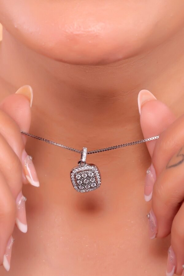 Elegant Diamond Pendant Necklace on Black Textured Background - Image 3